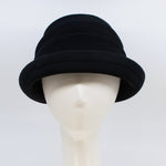 Load image into Gallery viewer, Front view of the lillie &amp; cohoe beatrice hat. This hat is black with a tiered/folded crown and a rounded brim.
