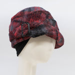 Load image into Gallery viewer, Front right side view of a the lillie &amp; cohoe iconic prints lexi hat. This has has red and grey plaid and a tiered/folded crown. The right side of the hat has a decorative black buckle.
