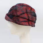 Load image into Gallery viewer, Left side view of a the lillie &amp; cohoe iconic prints lexi hat. This has has red and grey plaid and a tiered/folded crown. The right side of the hat has a decorative black buckle.

