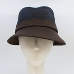 Load image into Gallery viewer, front view of the lillie &amp; cohoe midnight/brown wool classic alexa hat. This hat is midnight blue on the top and dark brown on the bottom. The hat has a flat brim.
