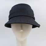 Load image into Gallery viewer, Front view of the lillie &amp; cohoe midnight phoebe wool classic hat. This hat has a tiered/layered crown and an asymmetrical brim that points to the left.
