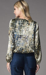 Load image into Gallery viewer, Back top half view of a woman wearing the lola &amp; Sophie alligator zip-neck top. This top is light green with a navy alligator print. It has banded long sleeves.
