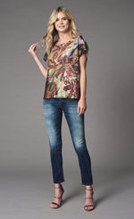 Load image into Gallery viewer, Front full body view of a woman wearing the lola &amp; sophie fairytale top. This top has short sleeves and a bias cut. The print on the top has warm autumn colors mixed in with a wine colored floral print.
