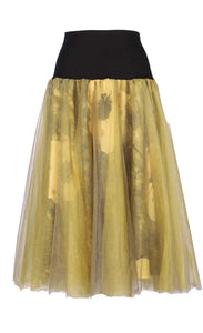 Front view of the luukaa floral tulle skirt in khaki. This skirt has khaki tulle and a floral lining that shows through underneath. The skirt sits below the knees.