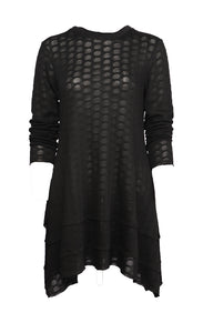 Front view of the Luukaa knitted dot tunic. This tunic is black with long sleeves, a crew neck, a pointed hem, and slightly see through dots.