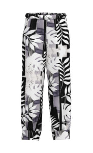 Front view of the Luukaa Leaf Print Pant. The pant is wide leg with a white and lilac leaf print all over it.