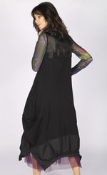 Load image into Gallery viewer, Back full body view of a woman wearing the luukaa long sleeveless dress. This dress is black with a tulle neckline and a structured fabric hem. The dress balloons out near the bottom.
