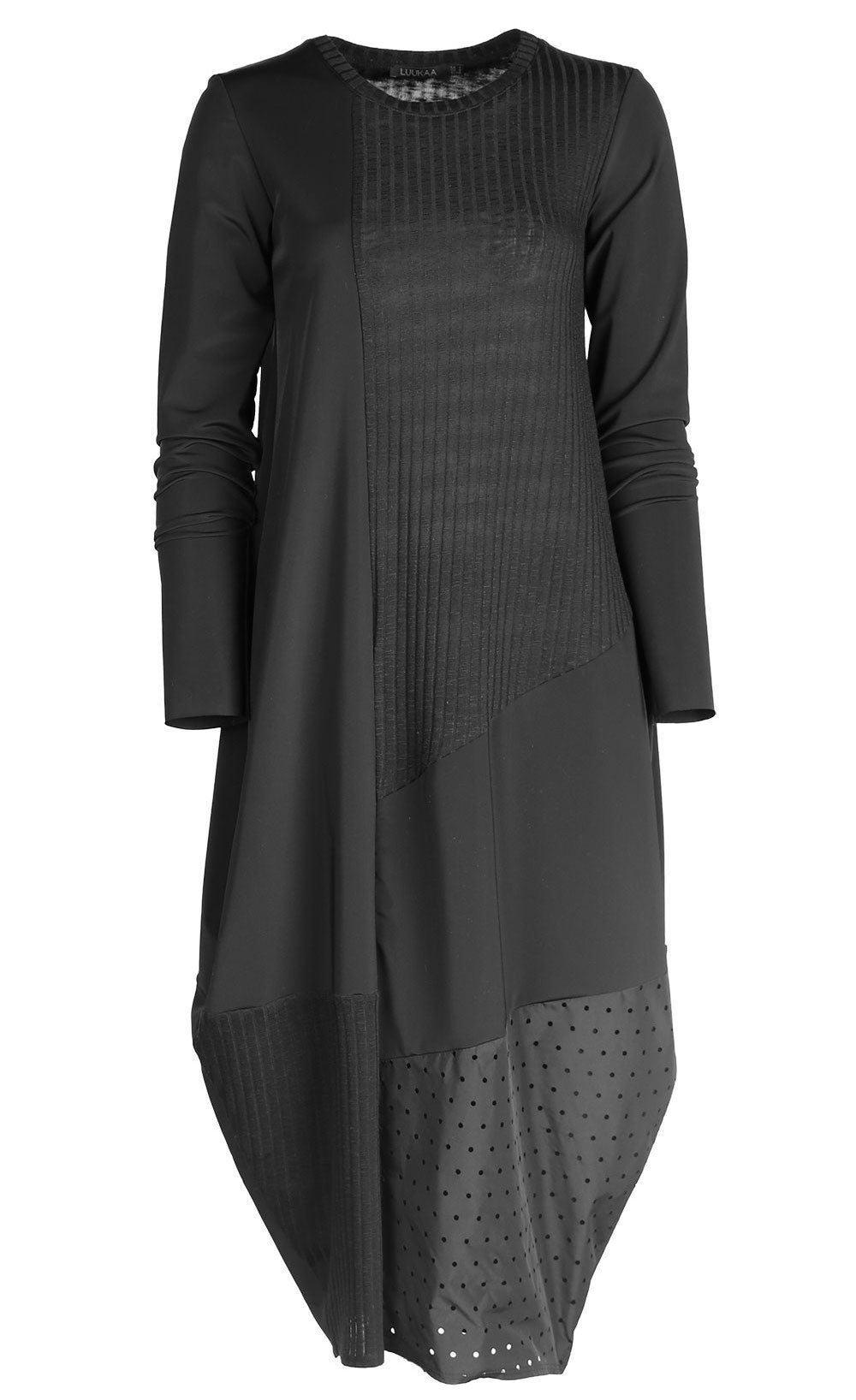 Front view of the black luukaa mixed media dress. This dress has long sleeves, a crew neck, and a mix of different black fabrics. The dress has extra space around the body with a tapered hem.
