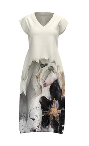 Front view of the luukaa watercolor dress. This short sleeve dress is predominantly off-white and features a watercolor flower print on the bottom. The dress also has a v-neck.