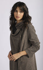 Load image into Gallery viewer, Front close up view of a woman wearing the luukaa wrap coat/jacket. This jacket/coat is mink/dark brown with a shawl collar, two front pockets, and long sleeves.
