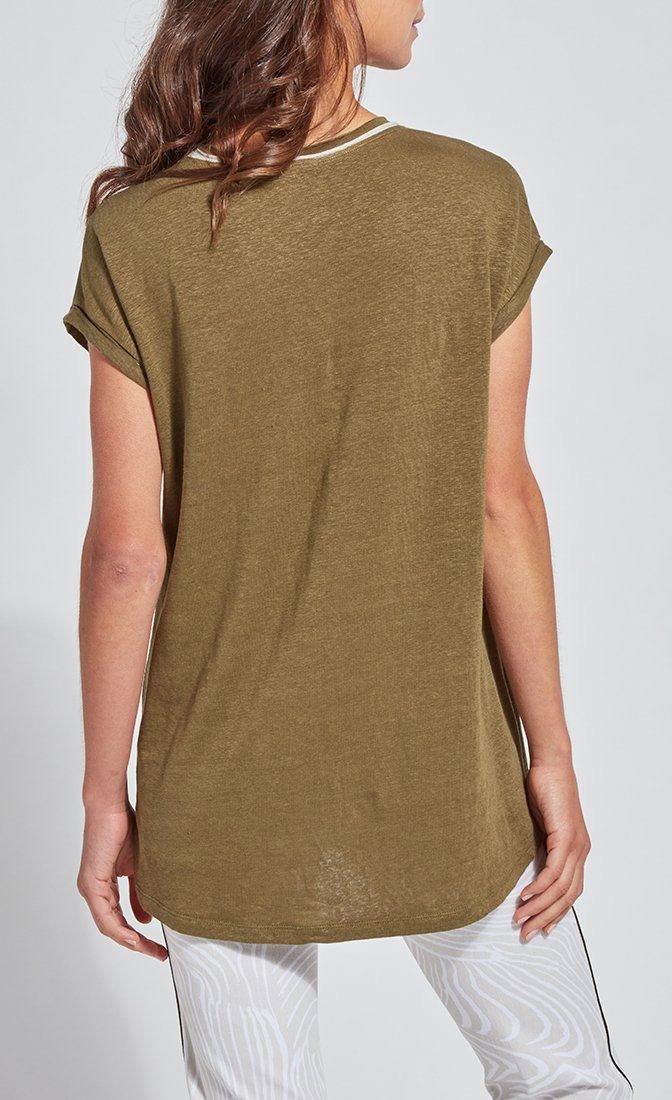 Back top half view of a woman wearing the lysse classic tee. This tee is jungle khaki colored. It has short drop shoulder sleeves and a high low hem. 