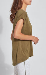 Load image into Gallery viewer, Right side top half view of a woman wearing the lysse classic tee. this tee is jungle khaki colored. It has short drop shoulder sleeves, a high low hem, and white edging around the round neck. 
