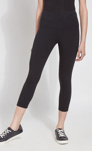 Front bottom half view of a woman wearing Lysse's Flattering Cotton Crop Legging. These leggings are black and have a high-rise, large waistband.