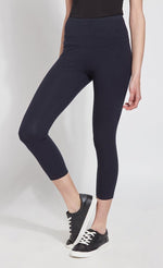 Load image into Gallery viewer, Front bottom half view of a woman wearing Lysse&#39;s Flattering Cotton Crop Legging. These leggings are navy and have a high-rise, large waistband.
