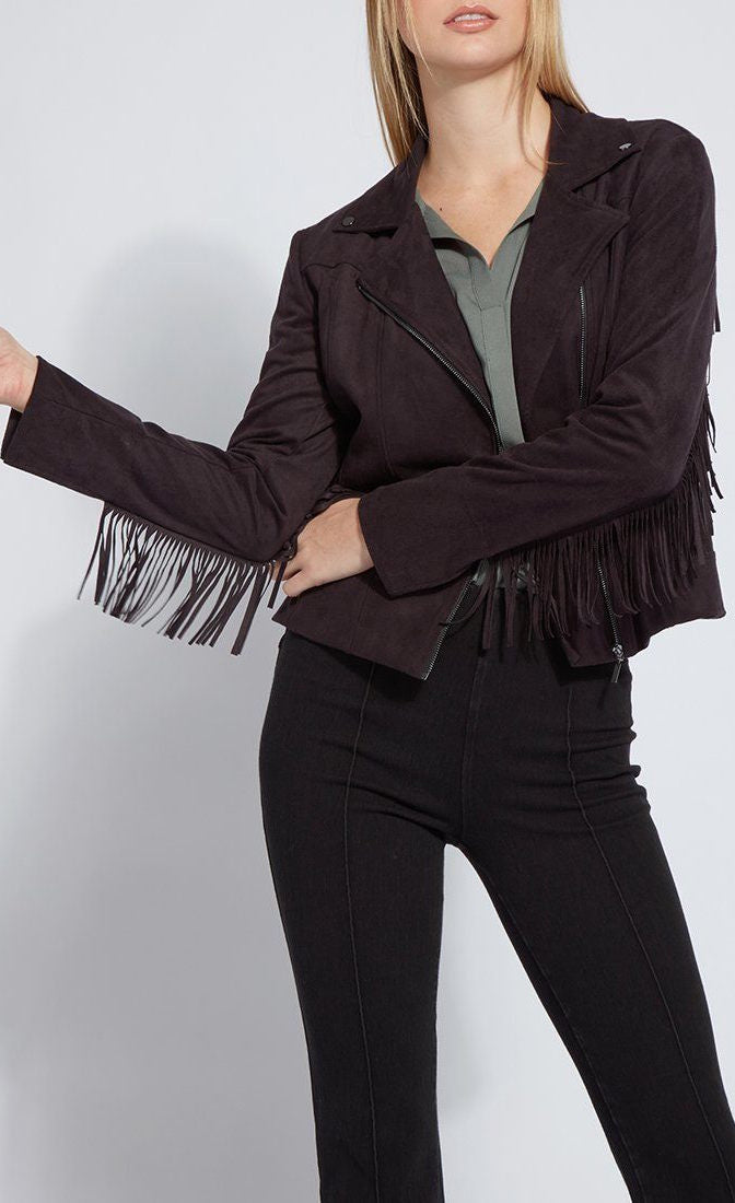 Front close up view of a woman wearing black pants and the black lysse spice fringe jacket. This jacket is suede looking. It has fringe all along the arms and back and a front zipper.