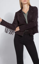 Load image into Gallery viewer, Front close up view of a woman wearing black pants and the black lysse spice fringe jacket. This jacket is suede looking. It has fringe all along the arms and back and a front zipper.
