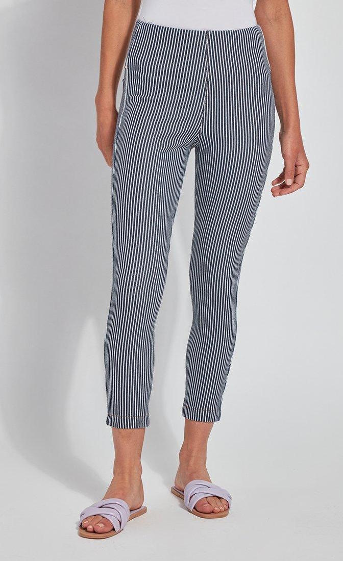 Front bottom half view of a woman wearing the Lysse Toothpick Crop Pattern Legging. These leggings are indigo and white pinstriped and high waisted.