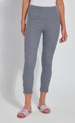 Load image into Gallery viewer, Front bottom half view of a woman wearing the Lysse Toothpick Crop Pattern Legging. These leggings are indigo and white pinstriped and high waisted.
