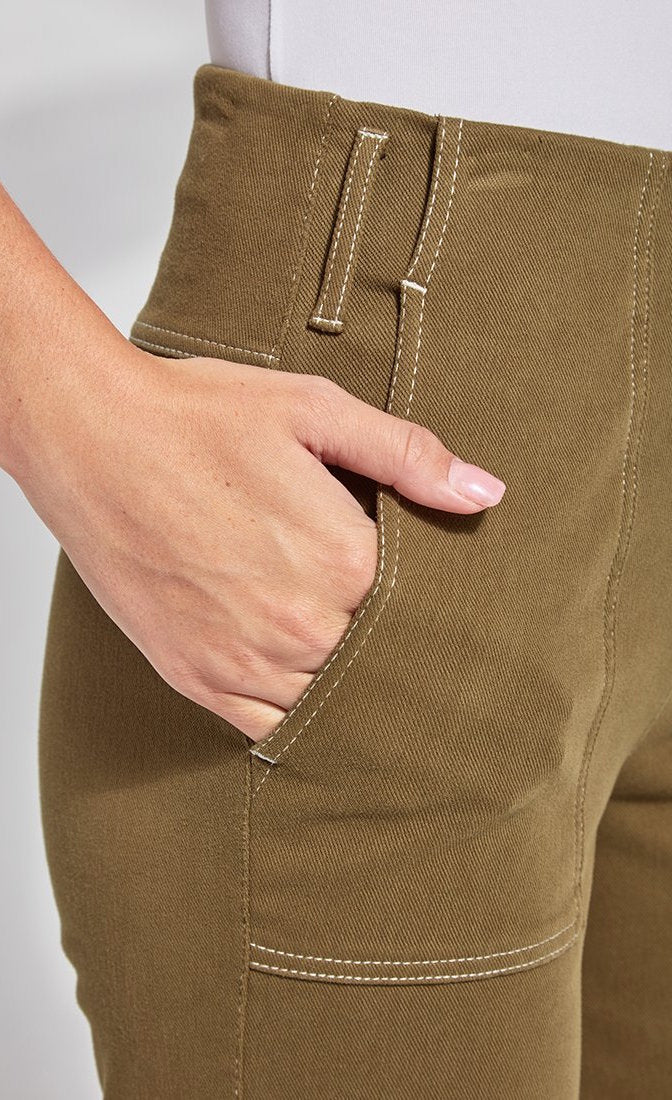 Front close up view of a woman wearing the lysse jade wide leg drop pant. This image shows the side pocket.
