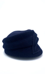 Load image into Gallery viewer, Right side view of the mao now hat in navy. This hat has a large stitched leaf on the left side.
