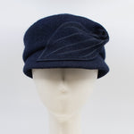 Load image into Gallery viewer, Front view of the mao now hat in navy. This hat has a large stitched leaf on the left side.
