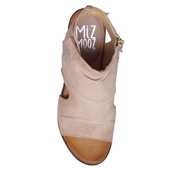 Birds-eye view of the miz mooz anna in the color pearl. This color is a faded pink. The upper covers most of the foot with small exposed sides, an exposed heel, and an open toe. 