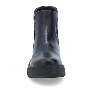 front view of the miz mooz lass boot. This boot is in black and has a wedge heel. 
