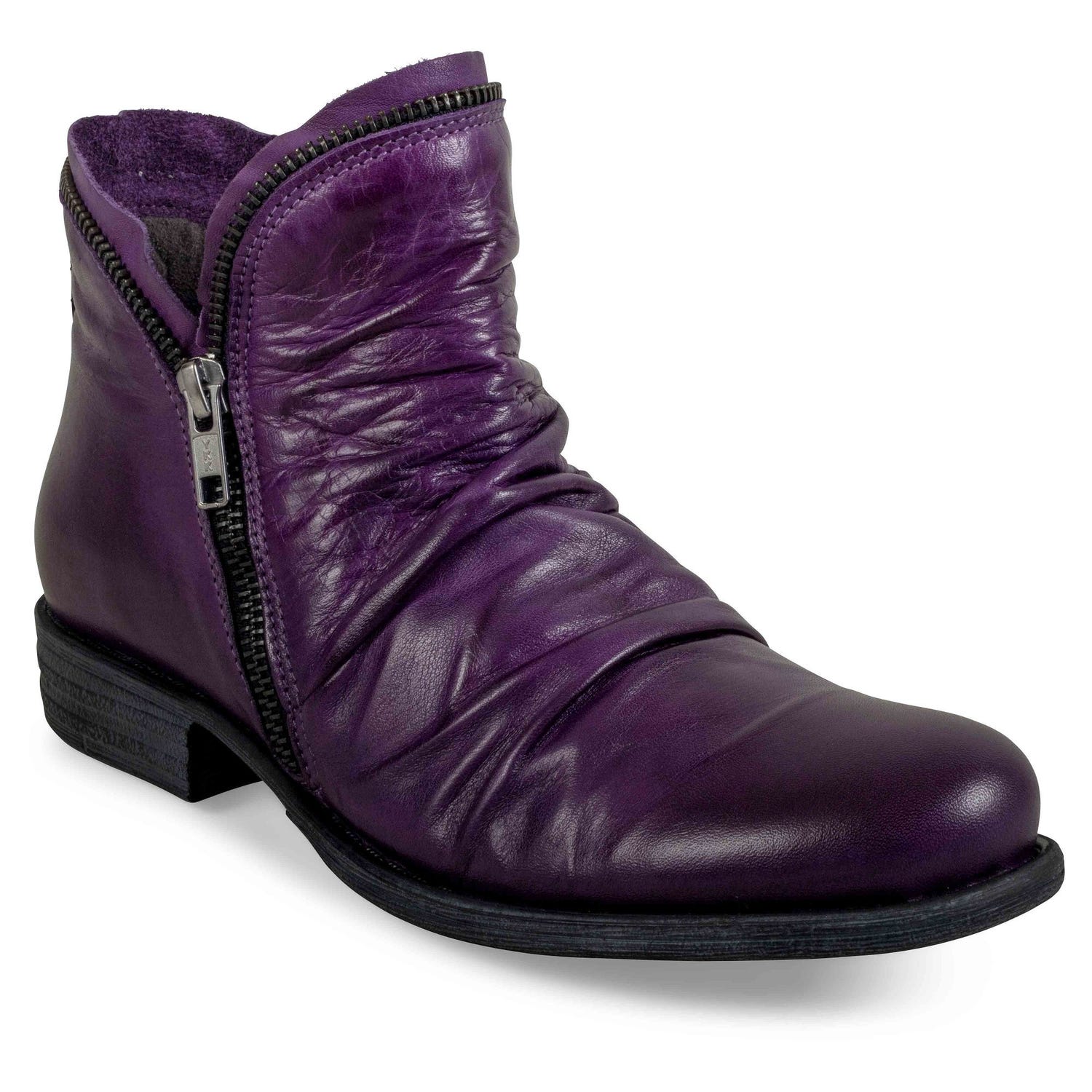 Outer front view of the miz mooz luna bootie in a deep dark purple color. This flat bootie has a zipper on the side and decorative zipper trim around the front and back opening for the foot.