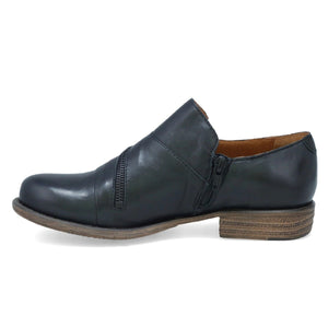 Inner view of the miz mooz lyric oxford shoe. This flat shoe is a slip on. It is black with a decorative zipper over the instep.
