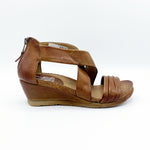 Load image into Gallery viewer, Outer side view of the miz mooz monarch sandal in the color brandy. This sandal has two leather straps that criss cross over the instep and another strap over the toes. The back of the sandal has a zipper and the sandal has a small wedge heel.
