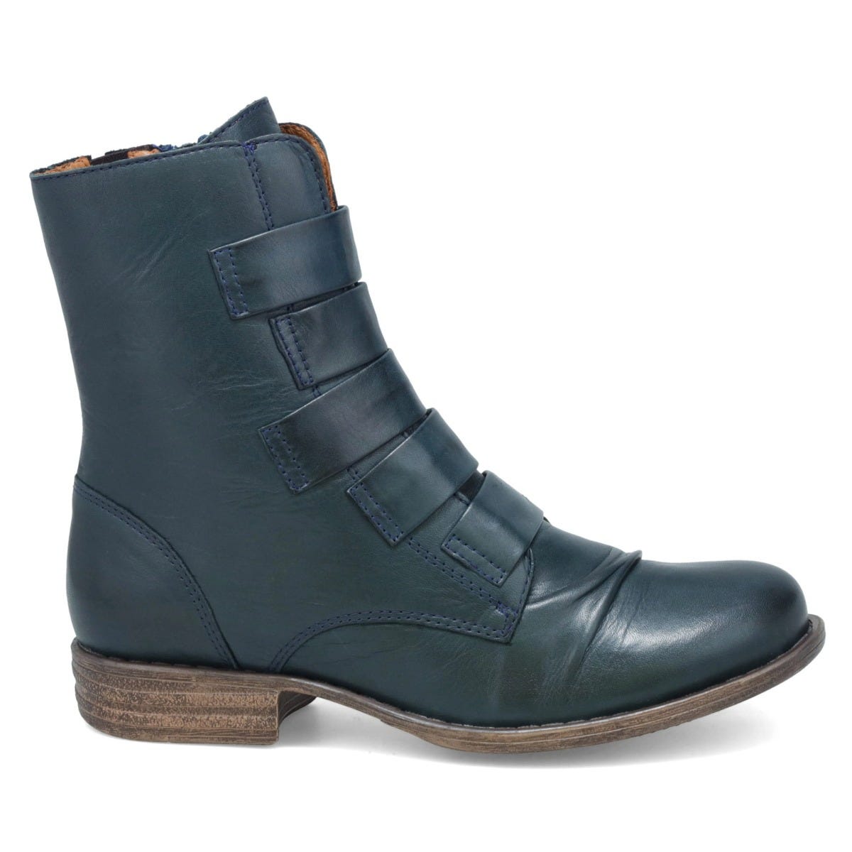 Outer view of the miz mooz leighton boot. This boot is ocean (dark blue) colored. It is slightly taller than ankle height and has decorative straps all along the front.