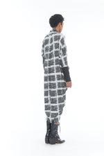 Load image into Gallery viewer, Back full body view of a woman wearing the mxmatthildur carly dress. This long sleeve dress has a white and black plaid print.
