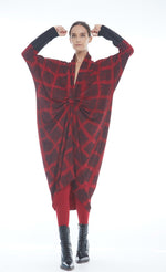 Load image into Gallery viewer, Front full body view of a woman wearing the mxmatthildur carly dress. This long sleeve dress has a red and black plaid print. It is also knotted in the front and gathers in the middle.
