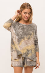 Load image into Gallery viewer, Front top half view of a woman wearing the mystree bluestone tie dye top. This top is a grey and yellow tie top with long sleeves and a boxy fit.
