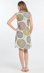Load image into Gallery viewer, Back full body view of a woman wearing the nic + zoe citrus dress. This dress is sleeveless and sits above the knees. It is pale yellow and grey with a large citrus slices print in yellow, blow and pink. 
