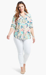 Load image into Gallery viewer, Front full body view of a woman wearing the nic+zoe color splash shirt. This shirt has a button up front, shirt collar, and long sleeves pushed up. It is multicolored with blue, pink, green, and salmon dots and strokes.
