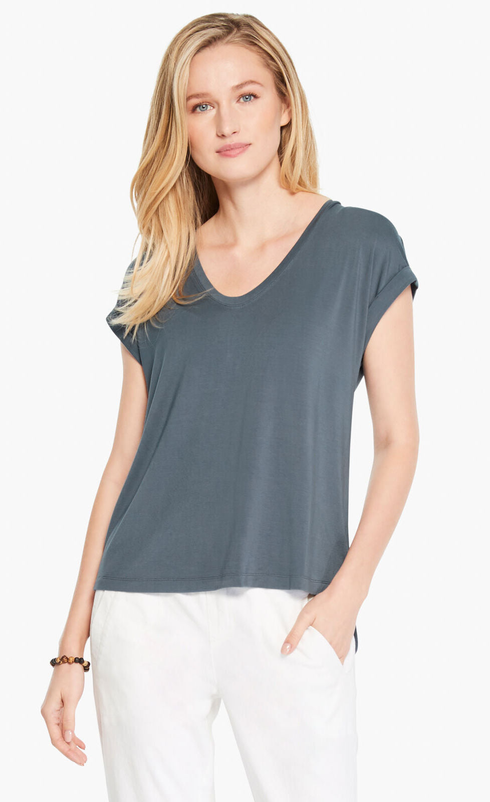 Front top half view of a woman wearing the Nic+Zoe Eaze V Tee. This tee is slate and has short sleeves and a v-neck.