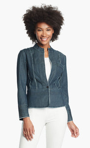 Front, top half view of a woman wearing white pants and the Nic + Zoe Favorite Denim Jacket. The dark denim jacket features frayed stiching, a single front button, and a short stand collar.