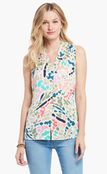 Load image into Gallery viewer, Front top half view of a woman wearing denim pants and the nic+zoe splash tank. This tank has multicolored dots all over it and a v-neck.
