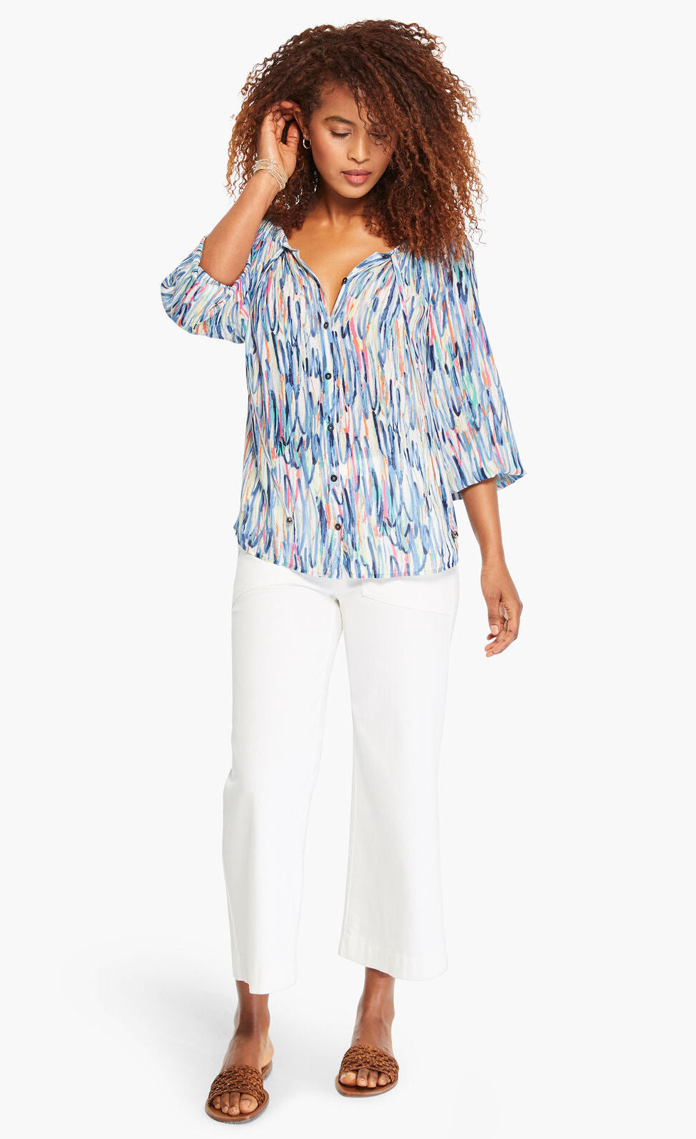 Front full body view of a woman wearing the nic+zoe toucan shirt. This top features a blue watercolor brush stroke print, a button down front, and 3/4 length sleeves.