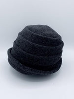 Load image into Gallery viewer, Left side view of the lillie &amp; cohoe beatrice hat. This hat is grey with a tiered/folded crown and a rounded brim.
