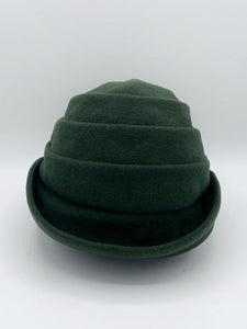 Front view of the lillie & cohoe beatrice hat. This hat is green with a tiered/folded crown and a rounded brim.