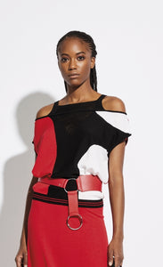 Front, top half view of a woman wearing the Oblique Creations Cold Shoulder Top. This cold shoulder top is black, red, and white, with connected short sleeves. The neck has a cutout mesh-like v-neck. On top of the top is a red belt near the waist.