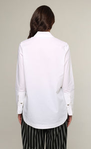 Back top half view of a woman wearing the Ozai N Ku White Shirt. This shirt is a classic white shirt cuffed long sleeves.