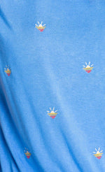 Load image into Gallery viewer, Close up view of the pj salvage sun out pj set. This set is sky blue with tiny embroidered sunsets all over it.
