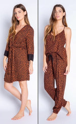 Load image into Gallery viewer, Front full body view of woman wearing the PJ Salvage Wild Love Robe on the left side and the wild robe top and banded pant on the right side. The short, mocha/brown colored robe and top and bottom have a heart shaped animal print all over them. The robe has contrasting black sleeves, and a belt at the waist. The top has thin straps and button detailing in the front. The Banded Pant has a black tie waistband.
