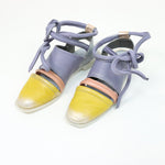 Load image into Gallery viewer, Outer and inner side view of a pair of the papucei etsy shoe. This shoe is flat. The front leather portion that covers the toe is yellow. The strap over the inset is pink and the rest of the shoe leather is purple. This shoe also has purple leather ankle ties.
