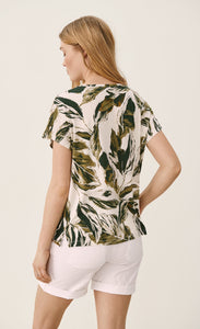 Back top half view of a woman wearing the part two icalina t-shirt. This t-shirt has a mixed green palm leaf print and short sleeves.