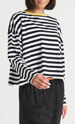 Load image into Gallery viewer, front top half view of the planet border stripe mini boxy tee. This top is black and white striped with long sleeves and a yellow border neckline.

