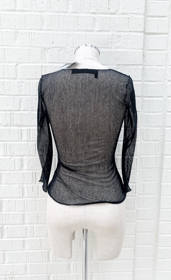 Back view of the porto diva sheer mesh tee. This tee is black with 3/4 length sleeves. 